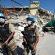 Asian U.N. workers patrol Haiti.